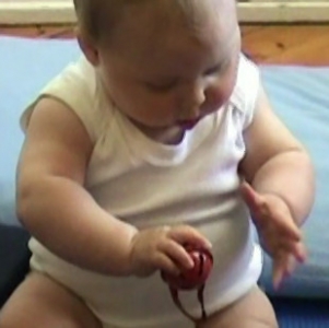 Lily 9m reach to grasp ball 1.jpg