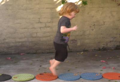 Max 2y9m jumping on circles.jpg