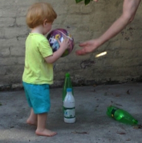 Toddler steps forward to take ball 4.jpg